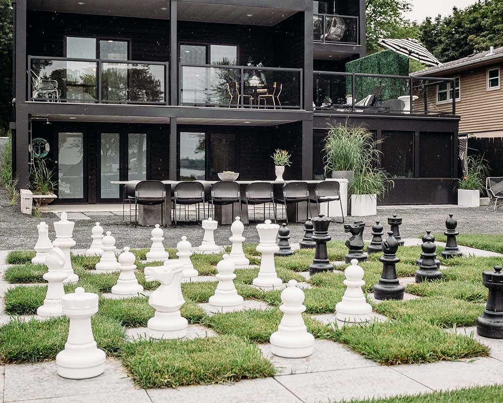A large yard sized chess yet in the backyard