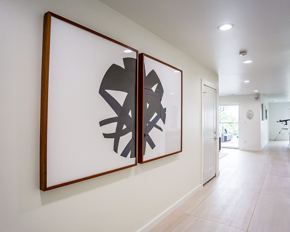 the updated entryway with modern art on the walls