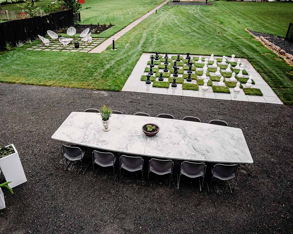 A long granite table in the backyard area