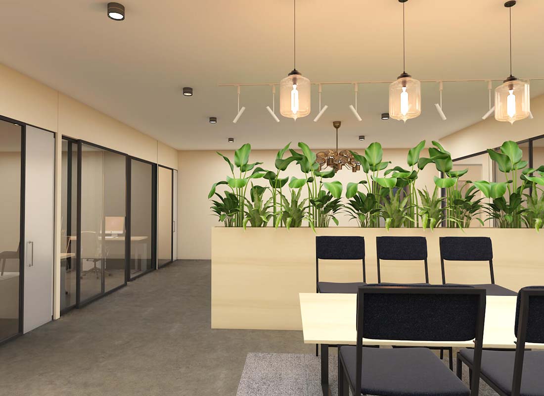 An office area with plants growing on a privacy wall