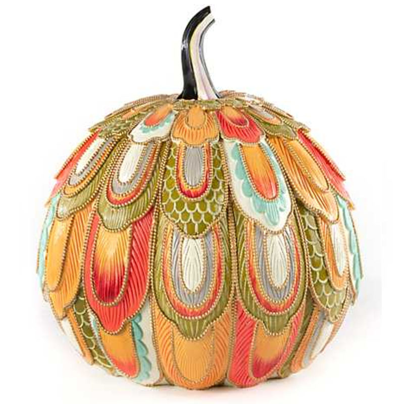 A pumpkin decorated with bead designs everywhere