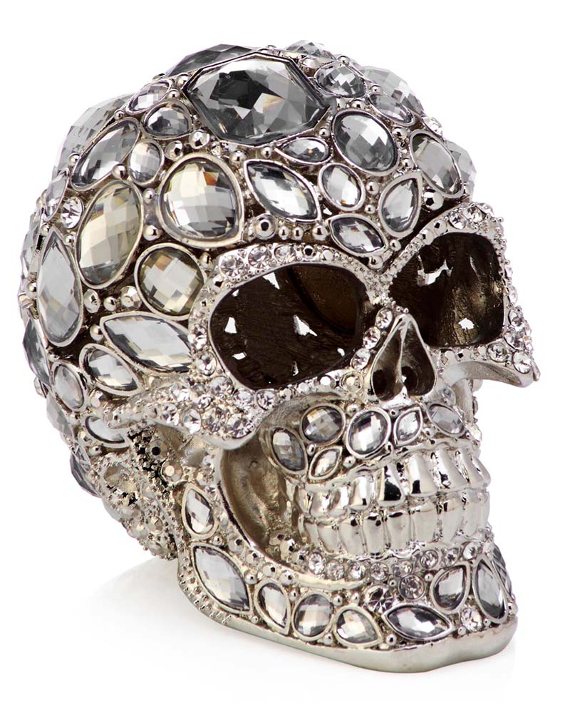 A sliver fake skull with bog jewels all over it