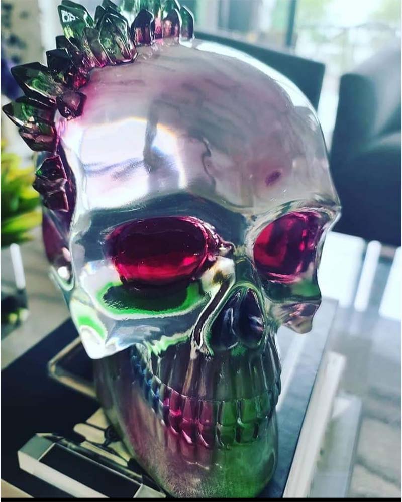 A fake skull with red and green crystals coming out of it