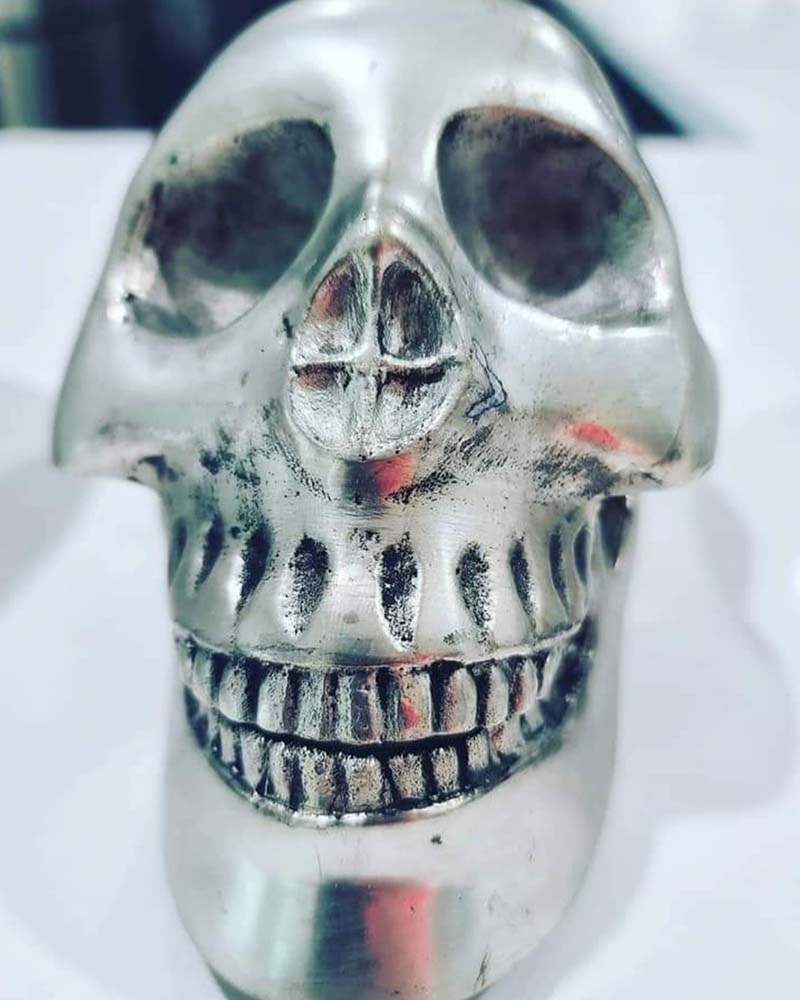 A sliver fake skull