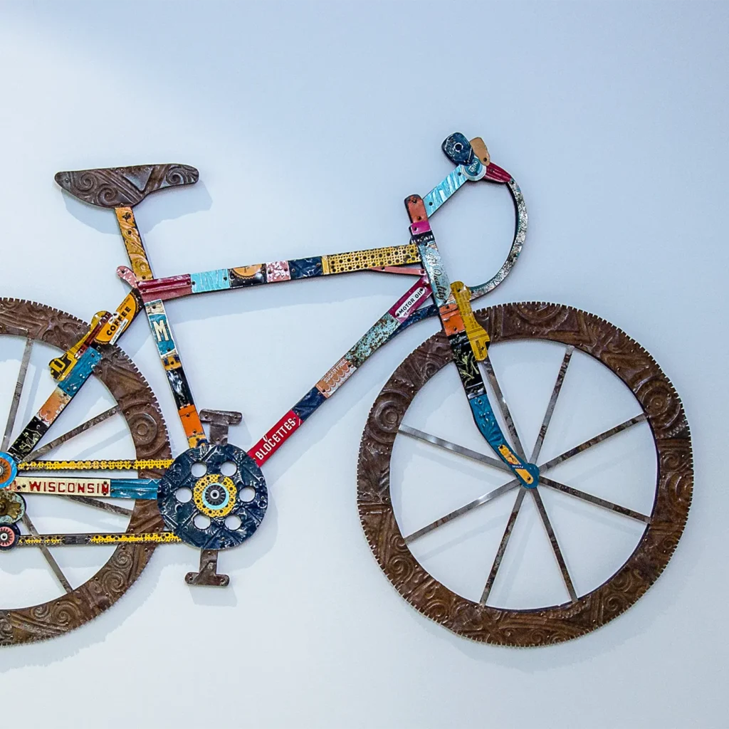 Colorful metal bicycle wall art with vintage-inspired decorative design