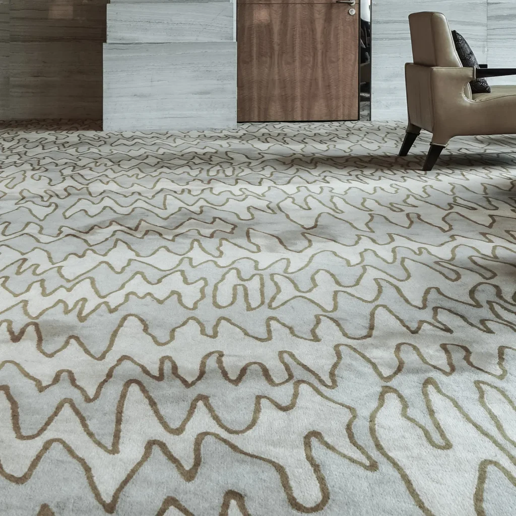 Modern patterned area rug in contemporary office lounge with neutral furnishings