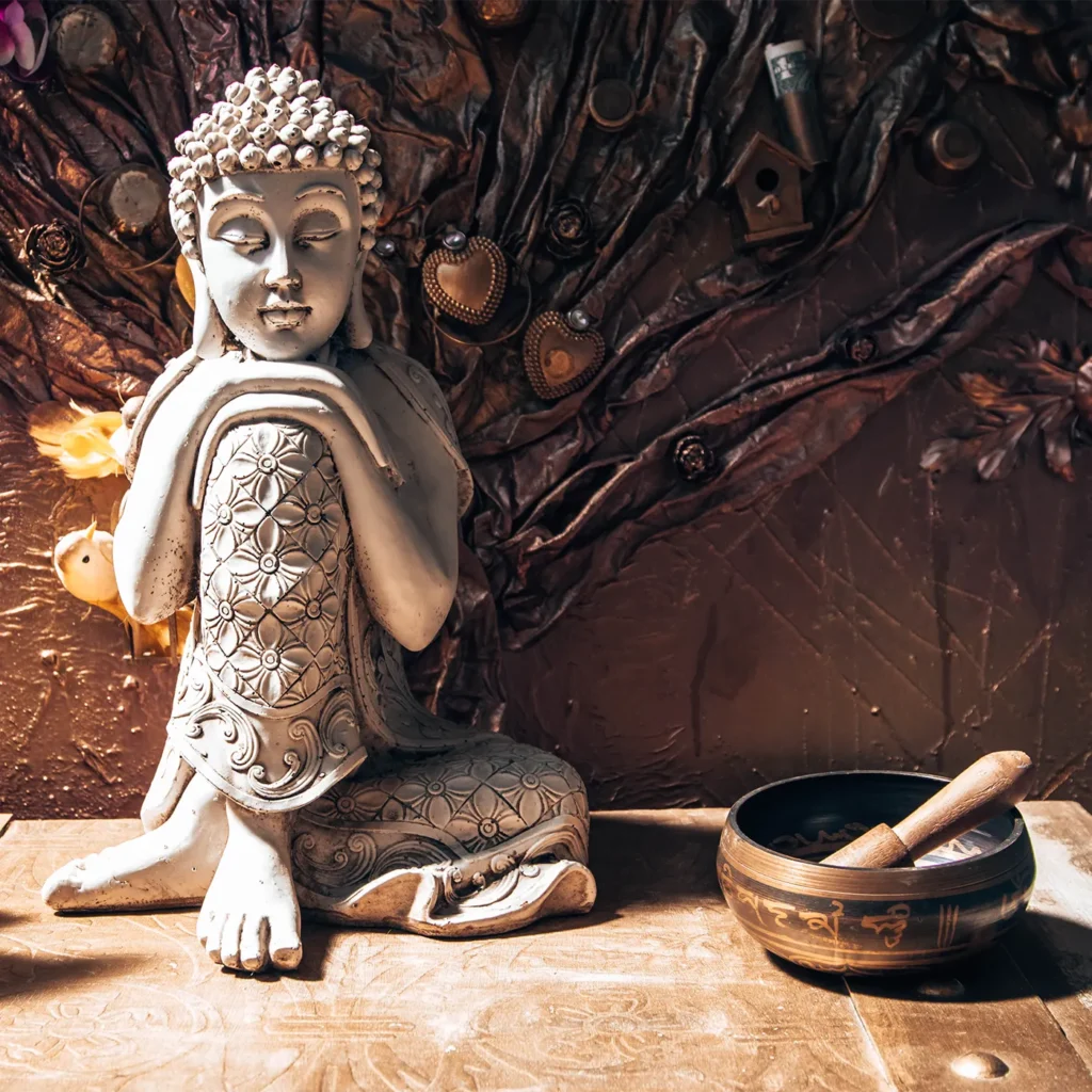 Decorative Buddha statue with meditation bowl and warm ambient decor